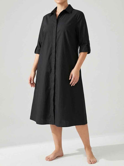 Agnes Summer Midi Shirt Dress in black — relaxed A-line silhouette, pointed collar, concealed button-front placket, tab-roll ¾ sleeves, angled front view on light background.