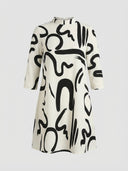 Alanna summer mini dress in white with black abstract swirl print, mock collar and three-quarter sleeves, front view