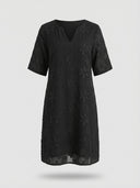 Amber Summer Mini Dress in Black — V-notch neckline, all-over floral embroidery on a straight shift silhouette, front view on white background.