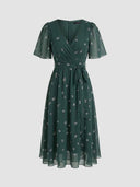 Amelia Flutter Sleeve Floral Midi Dress in deep forest green with shimmer floral sprig print and surplice V-neckline, straight front view on white background.