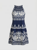 Amelia Halter Neck Mini Summer Dress in Blue, navy ground with white tribal geometric print and crisscross braided halter neckline, front view.