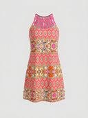 Amelia Halter Neck Mini Summer Dress in Pink, vibrant bohemian multicolour geometric pattern on pink ground with braided halter neckline, front view.
