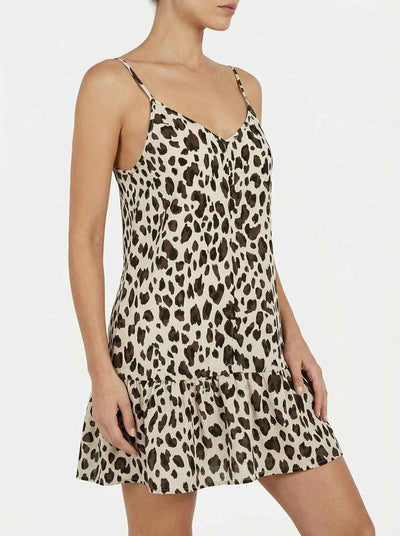 Amelia leopard print spaghetti strap mini dress in apricot cream and brown, angled front view showing V-neckline, thin straps and ruffled drop-hem.