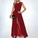 Red sleeveless jumpsuit with shoulder cutouts, flared legs, and front slits, front view.
