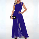 Royal blue sleeveless jumpsuit with shoulder cutouts and flared, sheer legs, front view.