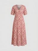 Beatrice Floral V-Neck Maxi Summer Dress in Pink with paisley floral print, short sleeves and V-neckline with tassel tie, front view on neutral background.