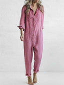 Pink linen-cotton jumpsuit with rolled sleeves and pant cuffs, front view.