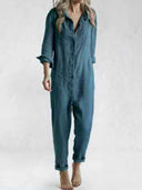 Teal linen-cotton jumpsuit with rolled sleeves and pant cuffs, front view on white background.