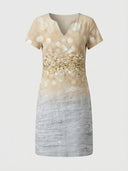 Charlotte V-Neck Short Sleeve Midi Dress in beige with contrast band and botanical print detail, front view on white background.