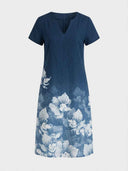 Charlotte Floral V-Neck Short Sleeve Midi Dress in navy blue with white botanical border print, front view on white background.