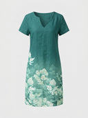 Charlotte Floral V-Neck Short Sleeve Midi Dress in teal green with white floral border print, front view on white background.
