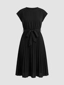 Black Ciara Pleated Cap Sleeve Midi Dress with self-tie bow belt and fully pleated A-line midi skirt, front view on grey background.