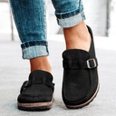 Black suede-look closed-toe platform mules with adjustable buckle strap and cushioned flatform sole, front angled view.