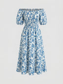 Daisy off-shoulder smocked floral mini dress in Blue, ditsy floral print on light ground, short puff sleeves and tiered ruffle hem, front view on white background.