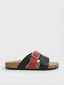 Black double-strap leather flat slide sandal with cork footbed and gold buckle, side view.