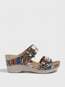 Snake print two-strap wedge sandals with floral embellishments, side view on white background.