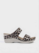 Leopard print two-strap wedge sandals with cushioned footbed and light grey wedge sole, side view.