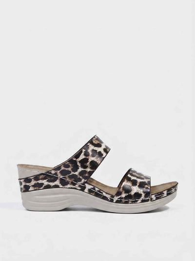 Leopard print two-strap wedge sandals with cushioned footbed and light grey wedge sole, side view.