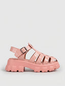 Pink crocodile-embossed cage flatform sandal with silver buckle strap, side view on white background.