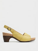 Yellow block heel sandals with cork platform and wood heel, side view.
