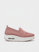 Pink slip-on platform knit trainer with white air-cushion sole, side view.