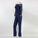 Navy blue lace off-shoulder jumpsuit with waist tie, side view on white background.