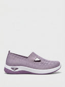 Lavender slip-on knit trainers with T-bar strap and cushioned sole — Lavender colourway, size 6.