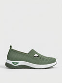 Army green slip-on knit trainers with T-bar detail and cushioned white midsole — Army Green colourway, size 6.