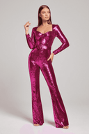 Fuchsia sequin jumpsuit with long sleeves, sweetheart neckline, and belt, front view.