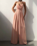 Peach jumpsuit with spaghetti straps, sweetheart neckline, and wide pleated legs, front view.