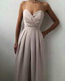 Beige spaghetti strap overall with pleated wide legs, front view on white background.