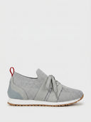 Grey knit lace-up barefoot trainer with suede panels, white midsole, and red pull tab at heel collar, side view.
