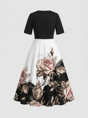 Black and white maxi dress with rose print, back view on a white background.
