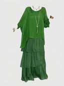 Green tiered chiffon mini dress with long sleeves, front view on white background.