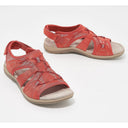 Red closed toe cushioned walking sandals with woven lattice upper, heel strap and flat beige-white sole, angled pair view.