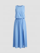 Light blue sleeveless maxi dress with elastic waist and side slit, front view on gray background.