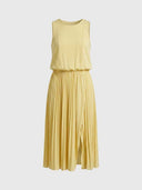 Pale yellow sleeveless maxi dress with pleated skirt and front slit, front view.
