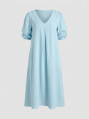 Light blue midi dress with V-neck, short puffed sleeves, and front pleats, front view.