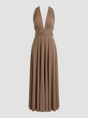 Long sleeve brown wrap mini dress with deep V-neck and crisscross waist, front view on white background.