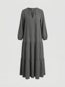 Dark gray tiered maxi dress with V-neck and long sleeves, front view on a white background.