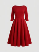 Red A-line midi dress with boat neck and three-quarter sleeves, front view on white background.