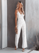 White lace jumpsuit with spaghetti straps, V-neck, and wide legs, front view.