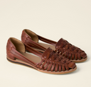 Brown closed-toe woven flat sandals with huarache strap upper and cushioned footbed, angled three-quarter view.