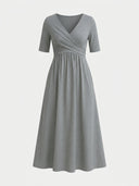 Gray midi dress with V-neck, short sleeves, and ruched waist, front view on white background.