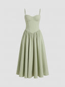 Light green sleeveless corset midi dress with spaghetti straps, front view.