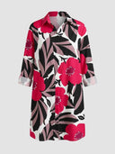 White mini dress with pink, black, and gray floral print, long sleeves, front view.