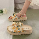 Cream flatform sandals with pineapple print bow detail and adjustable slingback strap, shown worn and in flat lay.