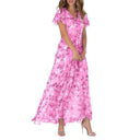 Pink botanical print maxi dress with flutter sleeves, angled front view.