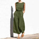 Olive green sleeveless jumpsuit with elastic waist and pockets, front view.