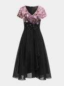 Black maxi dress with pink floral top, V-neck, and short sleeves, front view on white background.